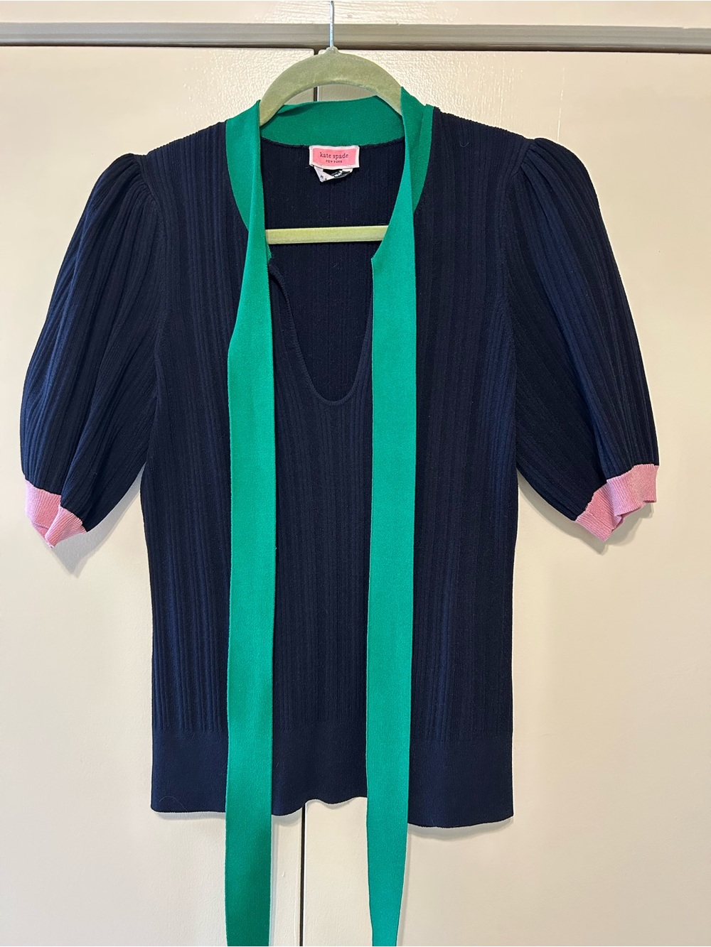 kate spade navy knit top with green tie and pink label